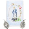 Medaille metal couleur argentee forme ovale H. 2,2 cm dans pochette avec image. Plusieurs saints