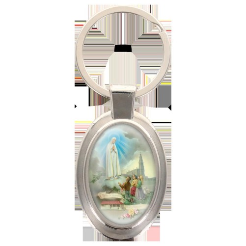Porte-clés en métal de couleur argenté de forme ovale H. 4.3 cm. Livré en boite cadeaux. Existe avec différents Saints.